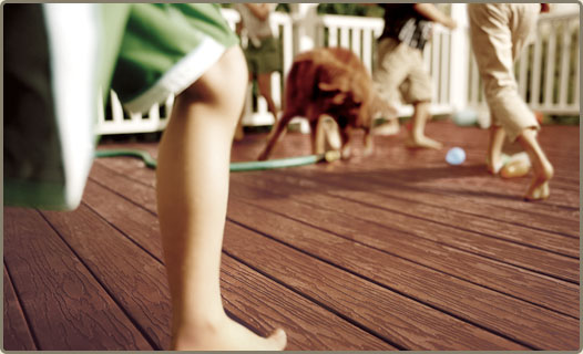 close-up of decking with legs and feet running across